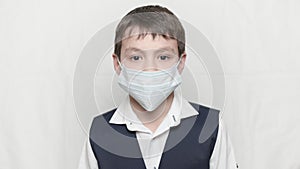 Coronavirus covid-19 epidemy outbreak healthcare concept of little boy in medical mask and school uniform