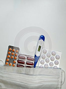 Coronavirus - covid-19. Masks, thermometer and pills.