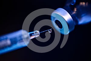 Coronavirus Covid-19 Protection and Vaccine. Medication drug needle syringe close up photo. Medication drug needle syringe