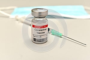 Coronavirus COVID-19 vaccine in vial and syringe