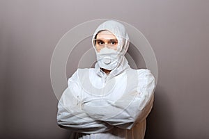 Coronavirus covid-19 disinfection. Portrait caucasian doctor in protective medical suit, biological hazard, medical mask FFP3, photo