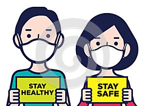 Woman and man wearing protective surgical masks holding a Stay Safe and stay healthy signboards photo