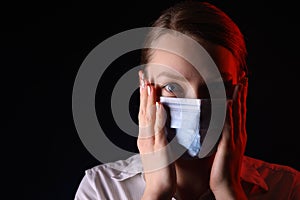 Coronavirus, a girl in a mask on a black background. Title about the outbreak of the corona virus in China, illness. Epidemic