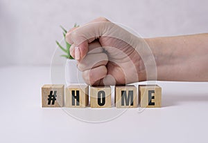 Coronavirus home lightbox sign with hashtag message HOME. COVID-19 text to promote self isolation staying at home