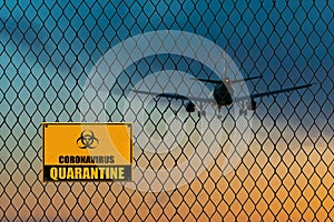 Coronavirus Infected passengers on board. Coronavirus disease COVID-19 disease outbreak alert sign handing on a wire fence.