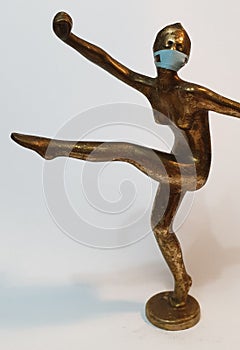 Coronavirus metaphore vintage brass statue dancer girl