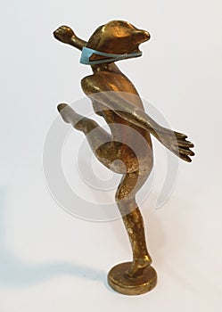 Coronavirus metaphore vintage brass statue dancer girl photo