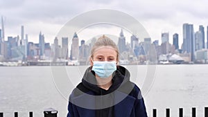 Coronavirus. New York. Woman with protection mask of virus epidemic and flu