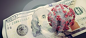 Coronavirus on one hundred dollar bill. Economic crisis