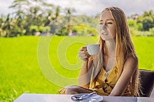 Coronavirus is over. Quarantine weakened. Take off the mask. Now you can go to public places. Woman with a cup of tea on