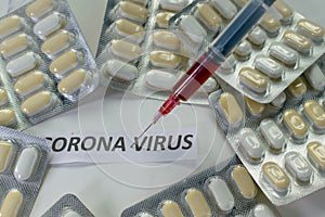 Coronavirus is pandemic. Coronavirus written, injection with blood. Photo about medicines