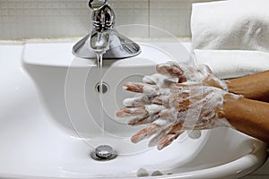 Coronavirus pandemic prevention wash hands with soap warm water,concept To prevent the covid-19