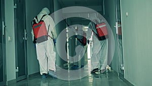 Coronavirus pandemic, virus prevention, COVID-19 concept. Hall is getting chemically decontaminated by the workers