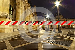 Coronavirus in Paris, France. COVID-19 sign. Concept of COVID pandemic and travel in Europe. The Louvre Palace