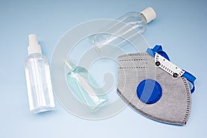 Coronavirus personal protective equipment concept. Medical ffp2 respirator, antibacterial gel.coronavirus flatly