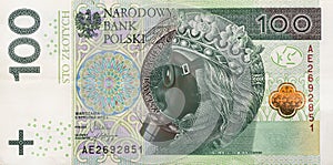 Coronavirus in Poland. Global recession. 100 Polish zloty banknote with a face mask . Polsh economy hit by corona virus covid19