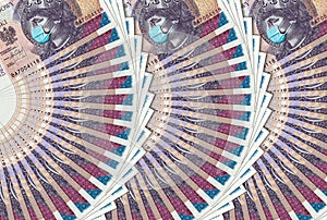 Coronavirus in Poland. Quarantine and global recession. 20 Polish zloty banknote with face mask