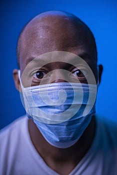 Coronavirus, portrait of a scared African American man with protective mask