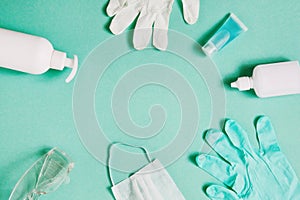 Coronavirus prevention. Top view medical mask, hand sanitizer gel, gloves and glasses for hand hygiene corona virus protection on