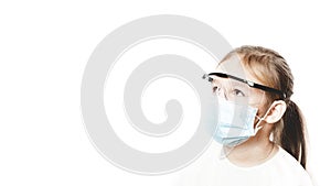 Coronavirus protection. The face of a child in a mask and glasses. A little preschool girl observes the prevention of covid 19.