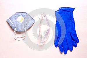 Coronavirus protective measures. Close-up of a N95 face mask or particle filtering half mask, a clear transparent safety glasses