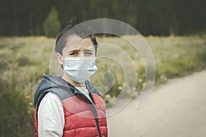 Coronavirus,sad kid wearing medical mask