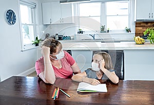 Coronavirus school closures and lockdown. Mum and bored daughter with masks studying online at home