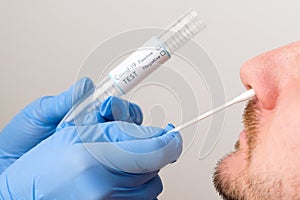 Coronavirus test. Medical worker or nurse taking a nasal swab for coronavirus sample from patient