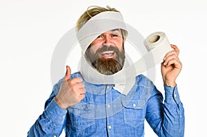 Coronavirus toilet paper shortage. Essential goods. Consumerism. Man hold toilet paper. Hipster Guy having fun. Softness