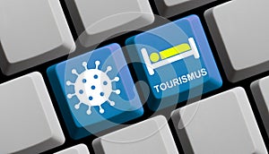 Coronavirus and Tourism in german language - Symbol of Bed and Covid-19 icon on computer keyboard
