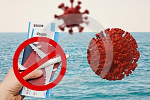 Coronavirus travel ban sign on a sea background