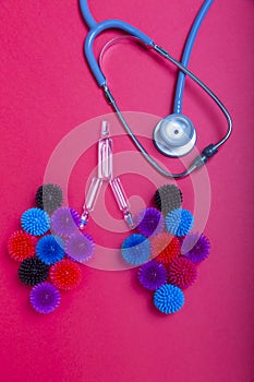 Model of lungs and stethoscope on red background