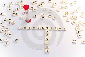 Coronavirus vaccine concept with Scrabble letters and hourglass