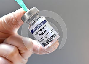 Coronavirus vaccine vial against COVID-19 virus at Pfizer photo