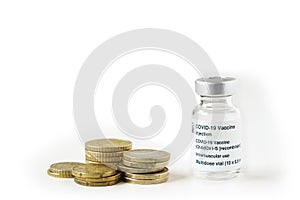 Coronavirus vaccine vial on top of a pile of coins on white background