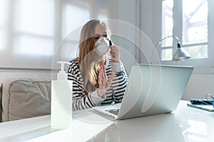 Coronavirus. Woman at the office sick with mask for corona virus. Business women wear masks to protect and take care of their heal