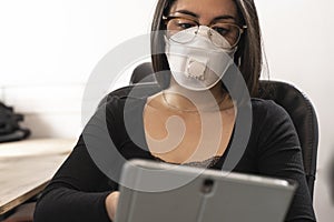 Coronavirus. Woman at the office sick with mask for corona virus. Business women wear masks to protect and take care of their heal