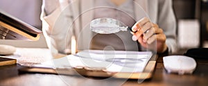 Corporate Auditor Using Magnifying Glass