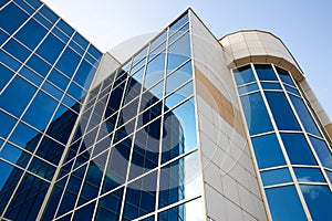 Corporate buildings, modern office building with glass windows and blue sky in the morning. High-rise, skyscrapers with