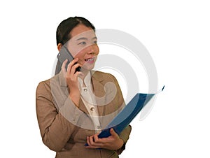 Corporate business success portrait of young attractive happy and confident executive Asian Korean woman talking on mobile phone