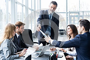 Corporate business team and manager in a meeting, close up photo