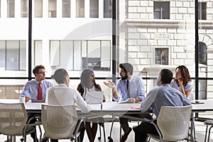 Corporate business team meeting in a modern open plan office