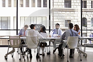 Corporate business team meeting in a modern open plan office