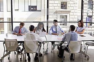 Corporate business team working in a modern open plan office