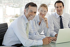 Corporate business teamwork - businessmen and woman working on laptop