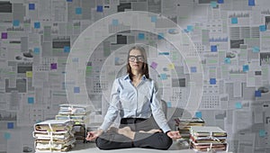 Corporate businesswoman practicing meditation in the office