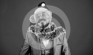 Corporate christmas party. Man bearded hipster wear santa hat and funny sunglasses. Christmas party organisers. Guy