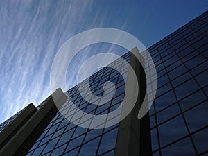 Corporate Cloudscape reflected in Commercial office building in Winnipeg Canada