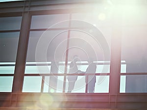 Corporate collaborations. Low angle shot of two businessman shaking hands in an office corridor.