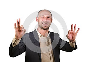 Young attractive and successful businessman smiling happy and confident isolated white background giving ok hand sign entrepreneur